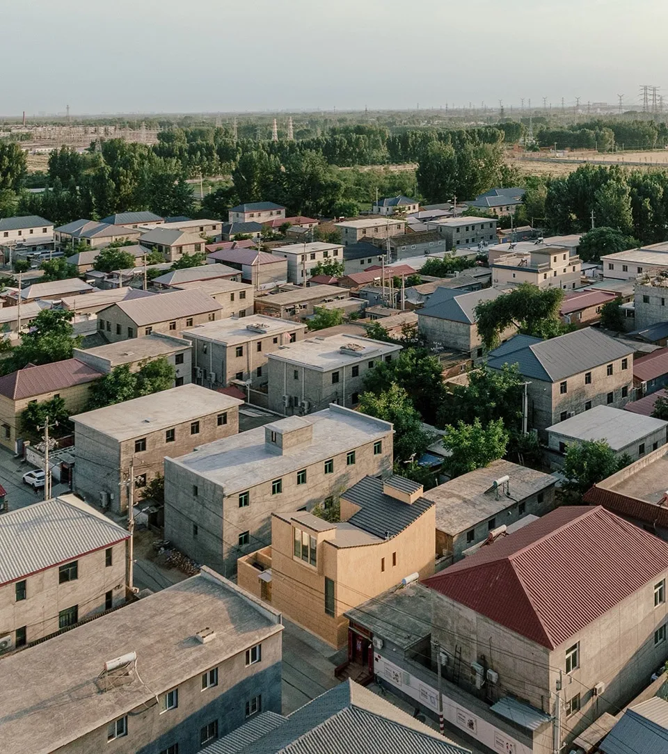 Aerial view of residential buildings with concrete and brick exteriors, featuring distinctive terrazzo flooring.