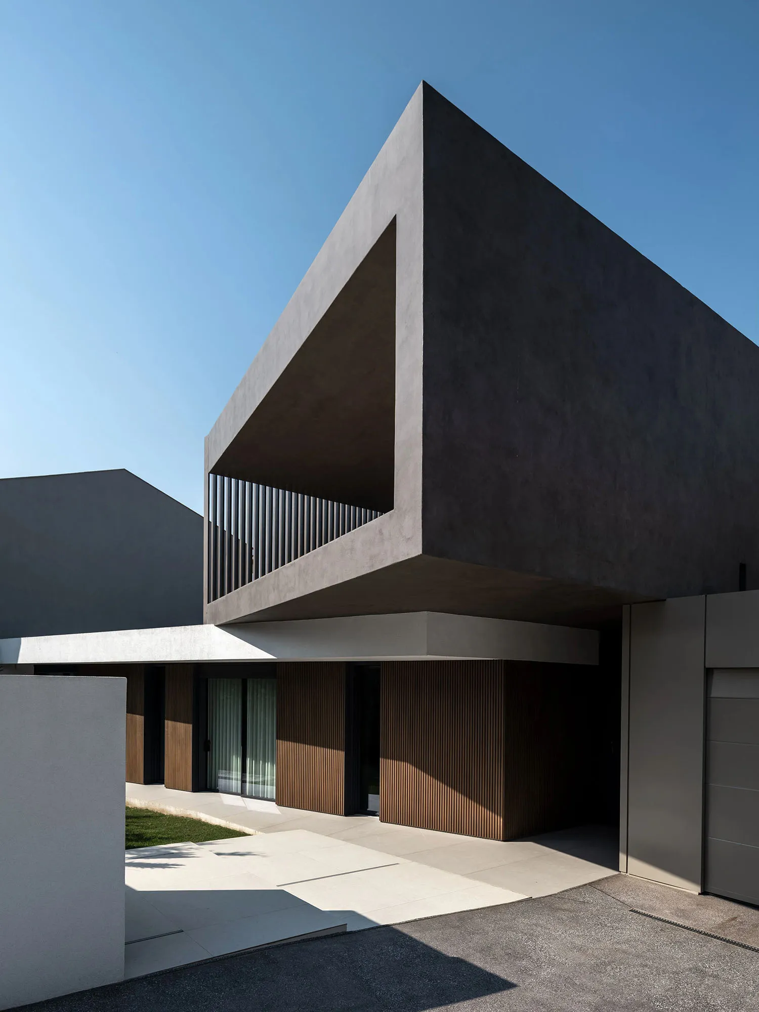 A modern house with concrete walls and a minimalist design.