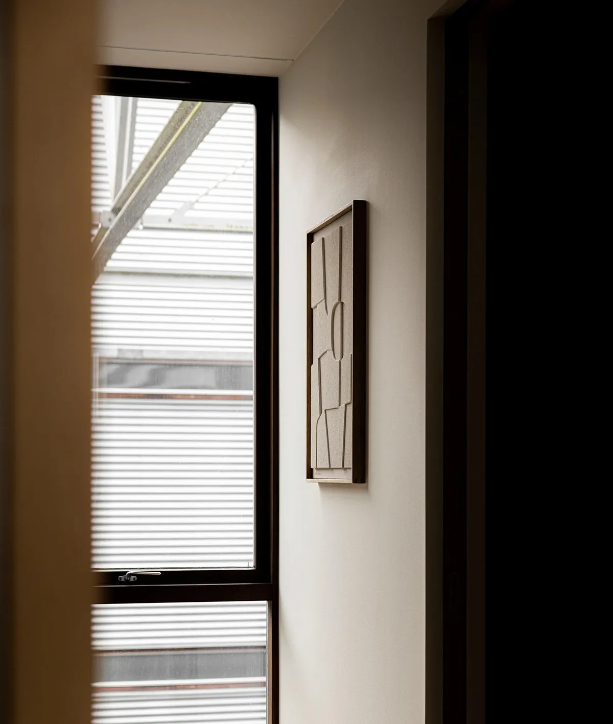 A modern window with textured material.