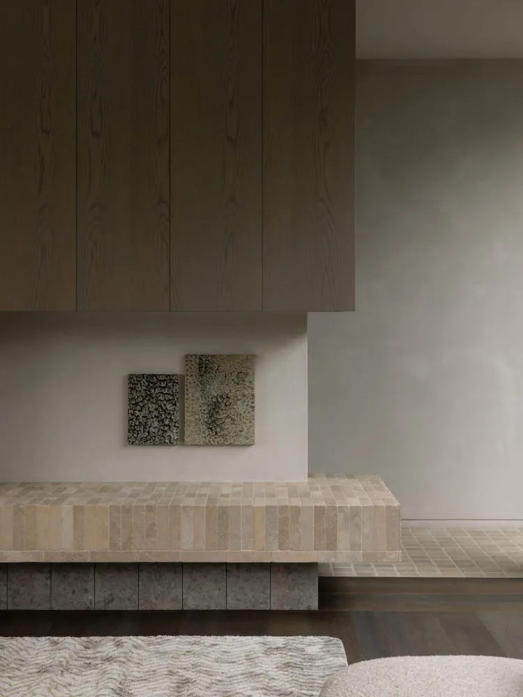 A minimalist interior design featuring a tiled counter surface.