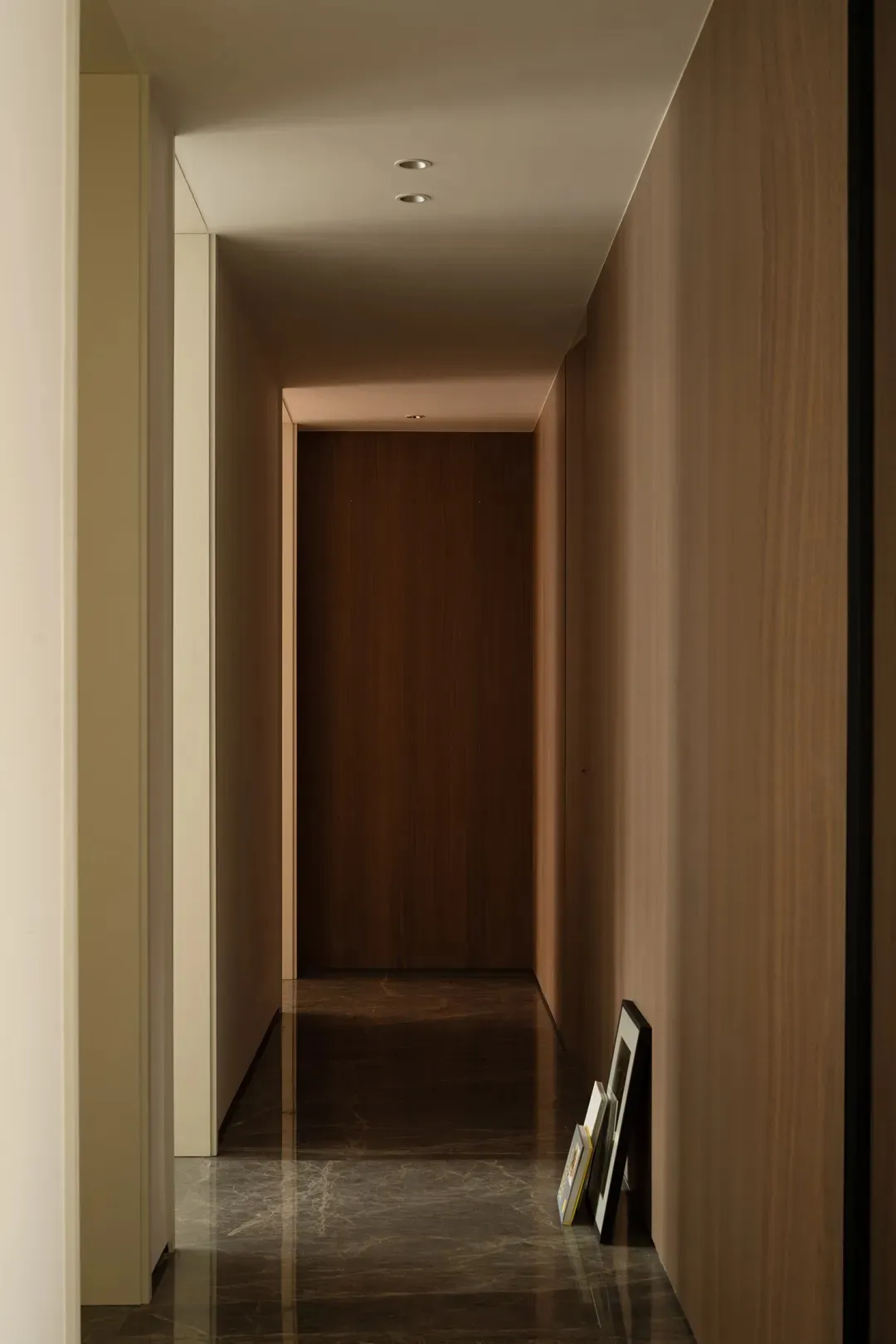 A minimalist modern interior featuring clean lines, sleek surfaces, and a monochromatic color palette.