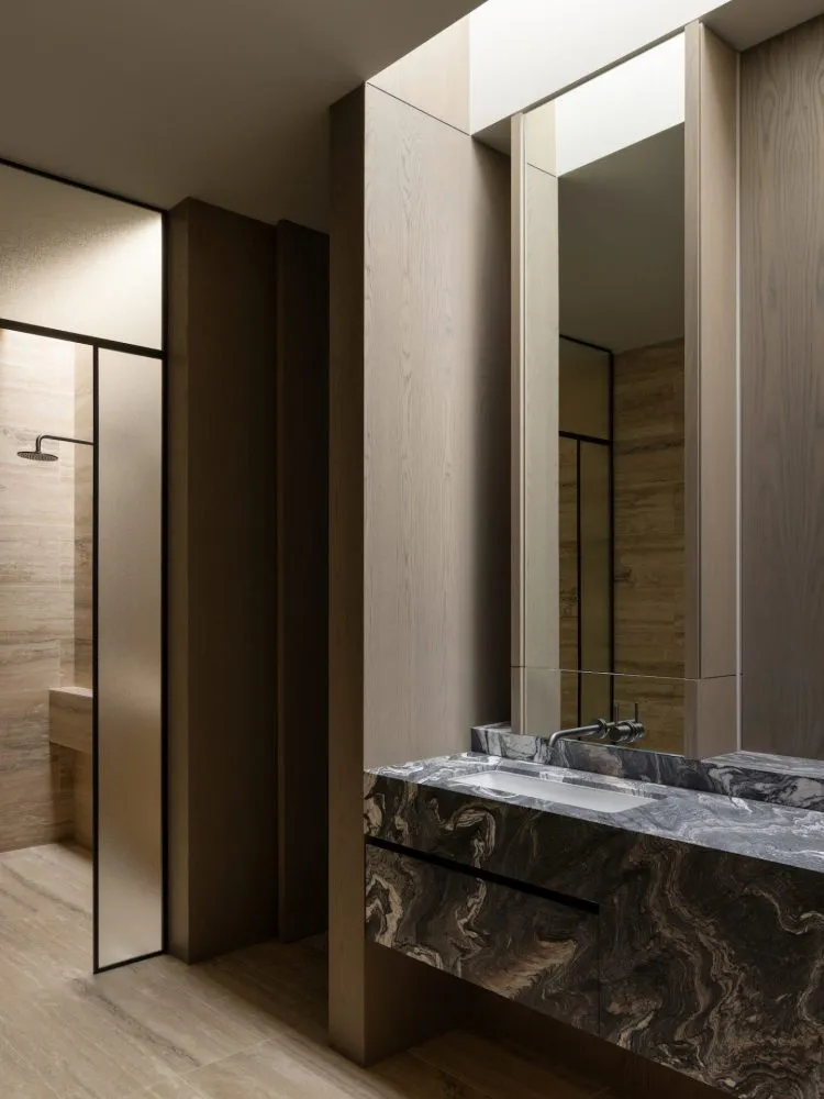 Modern bathroom with marble vanity and shower