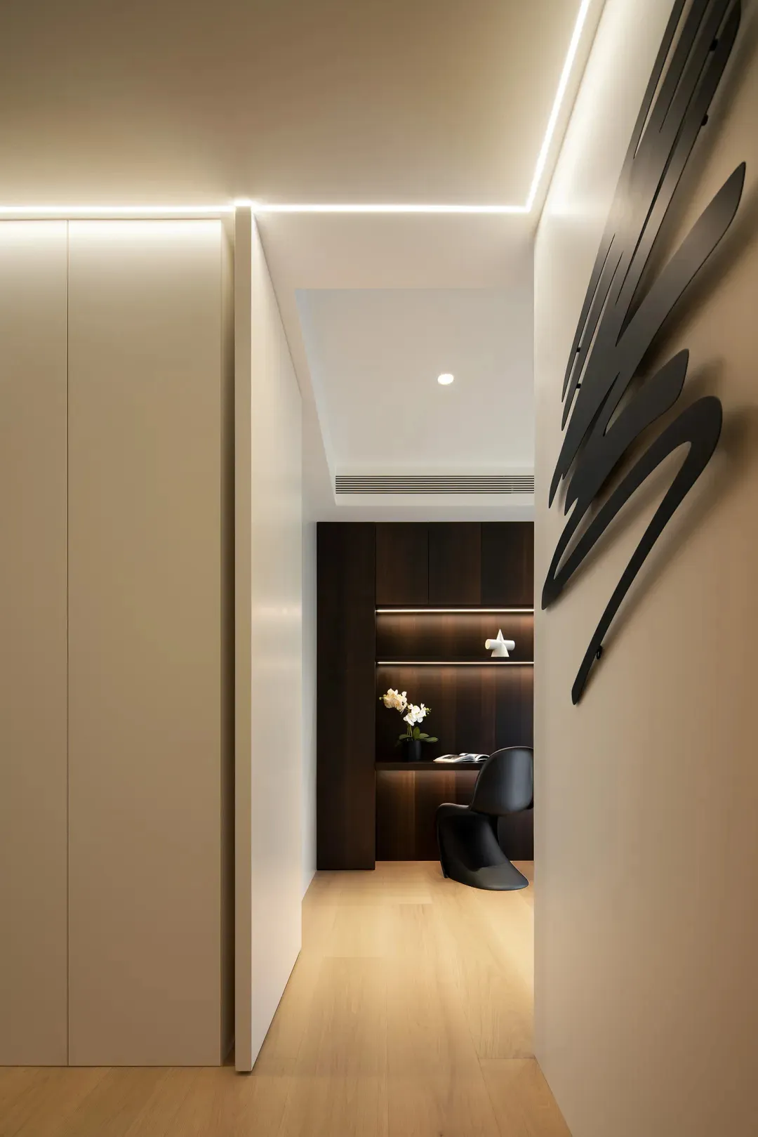 Minimalist modern office space with sleek, contemporary furniture and lighting.
