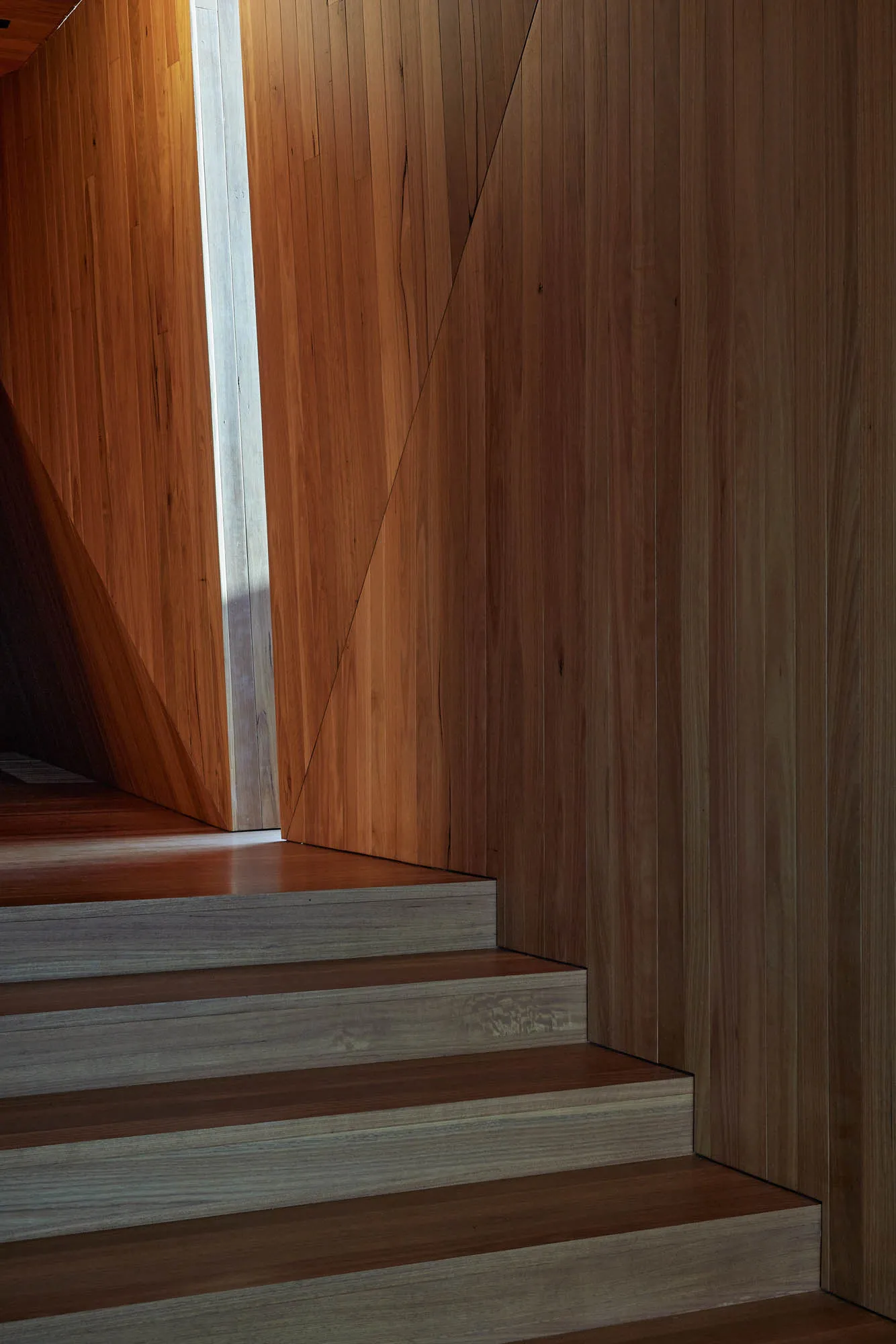 Modern interior design featuring a timber staircase