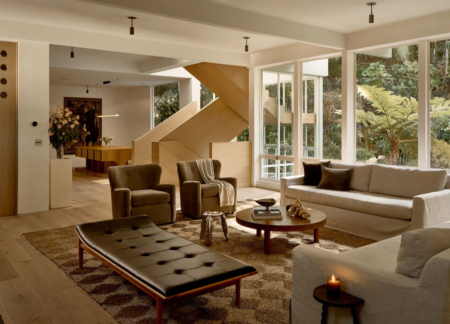 A modern living room featuring a combination of soft and hard materials with a focus on wood elements.