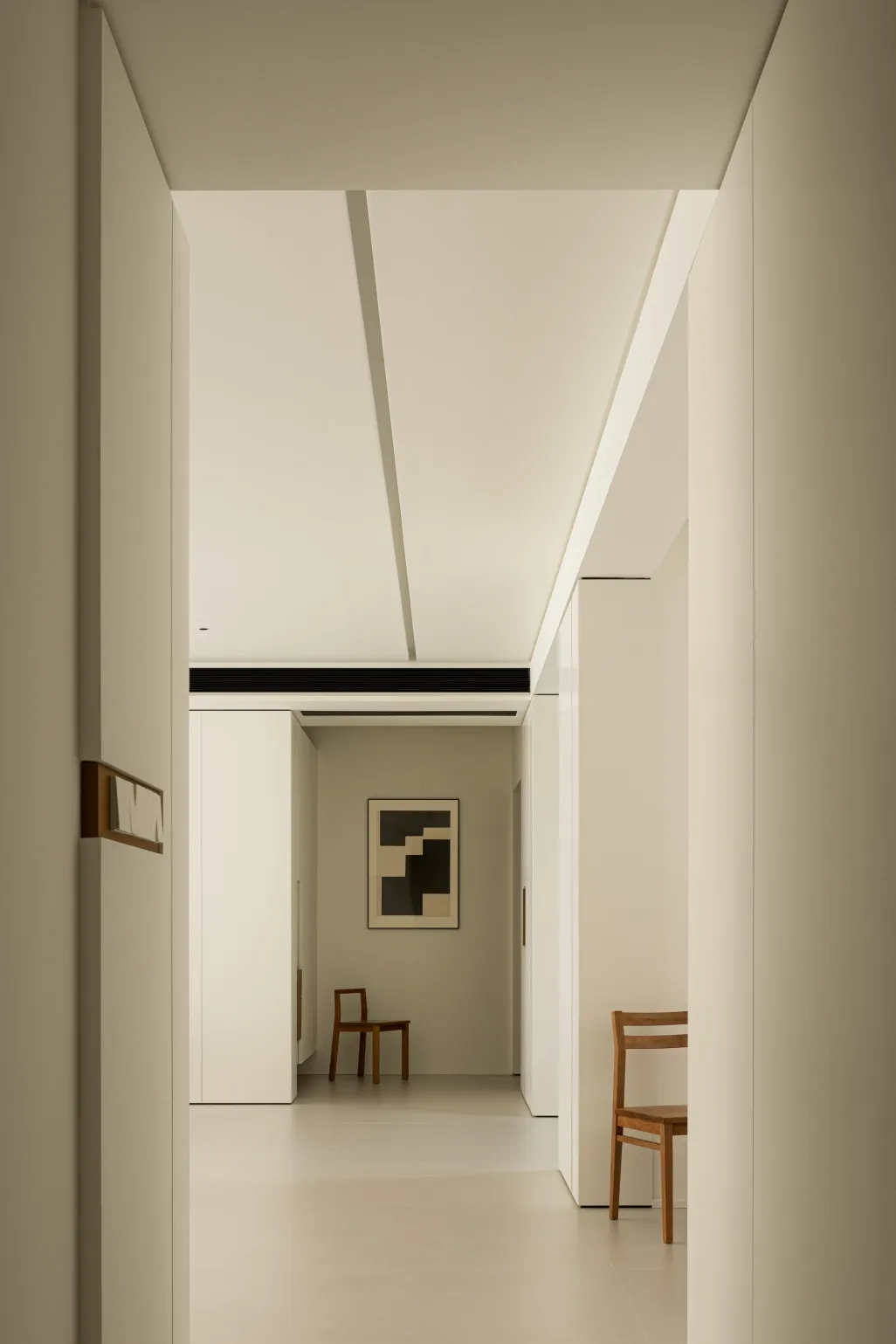A minimalist interior with white walls and floors.