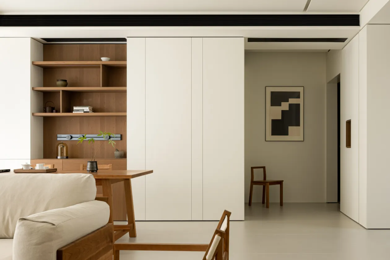 A minimalist home interior with wooden elements and a clean, modern design.