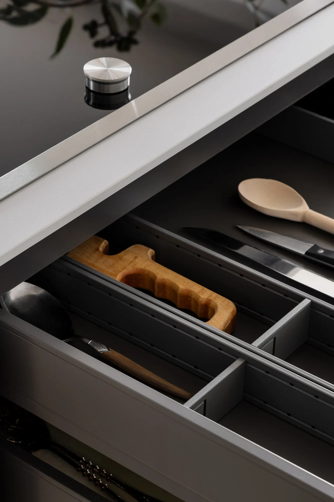 Modern kitchen storage solutions featuring metal and wooden elements.