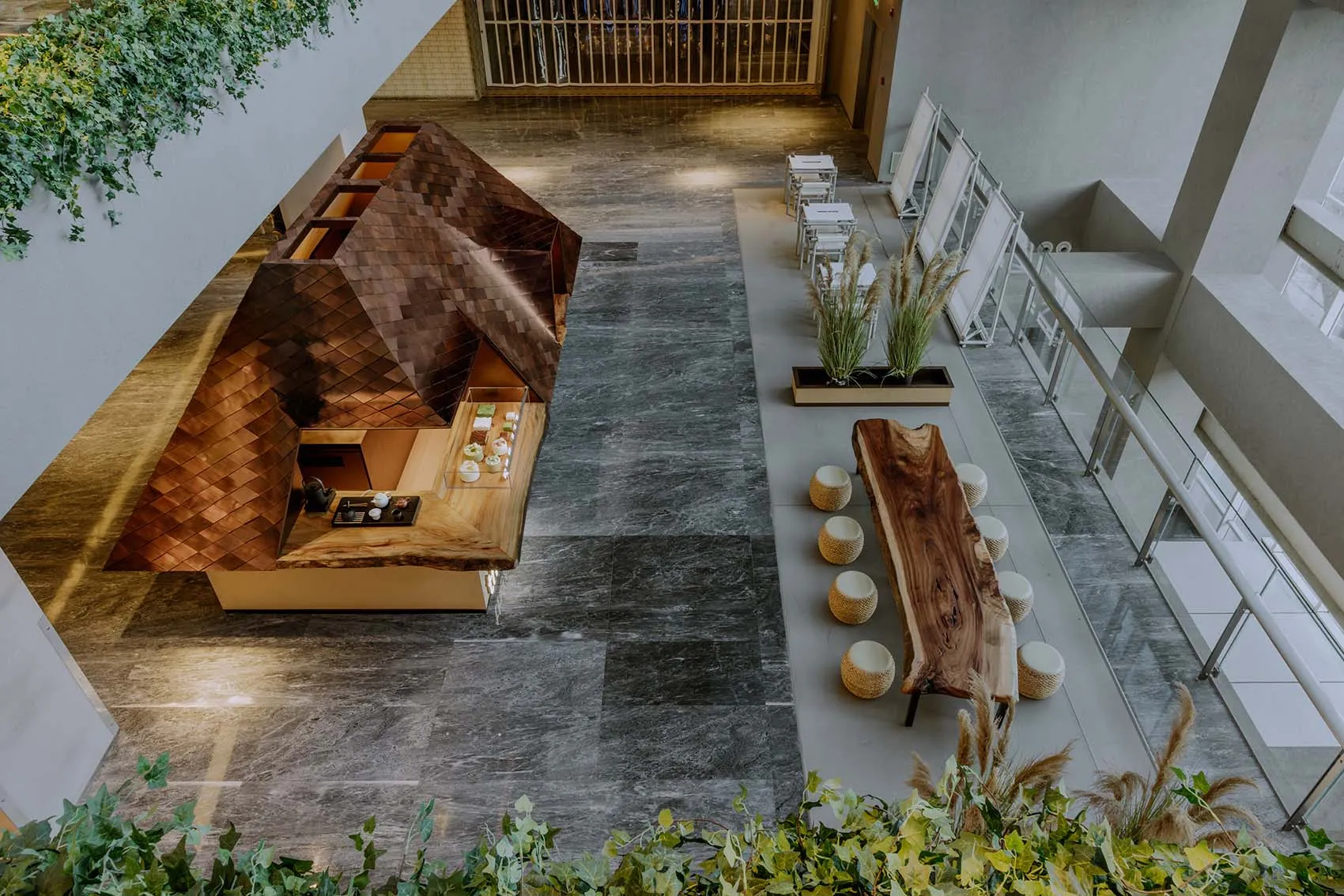 Industrial-style coffee shop with a wooden bar counter and seating area.
