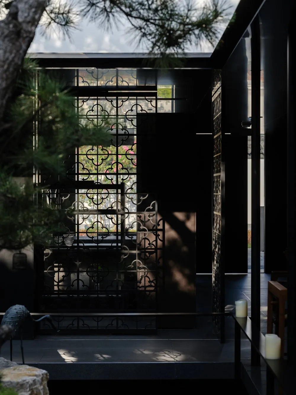 The image showcases a modern interior with black metal decor.