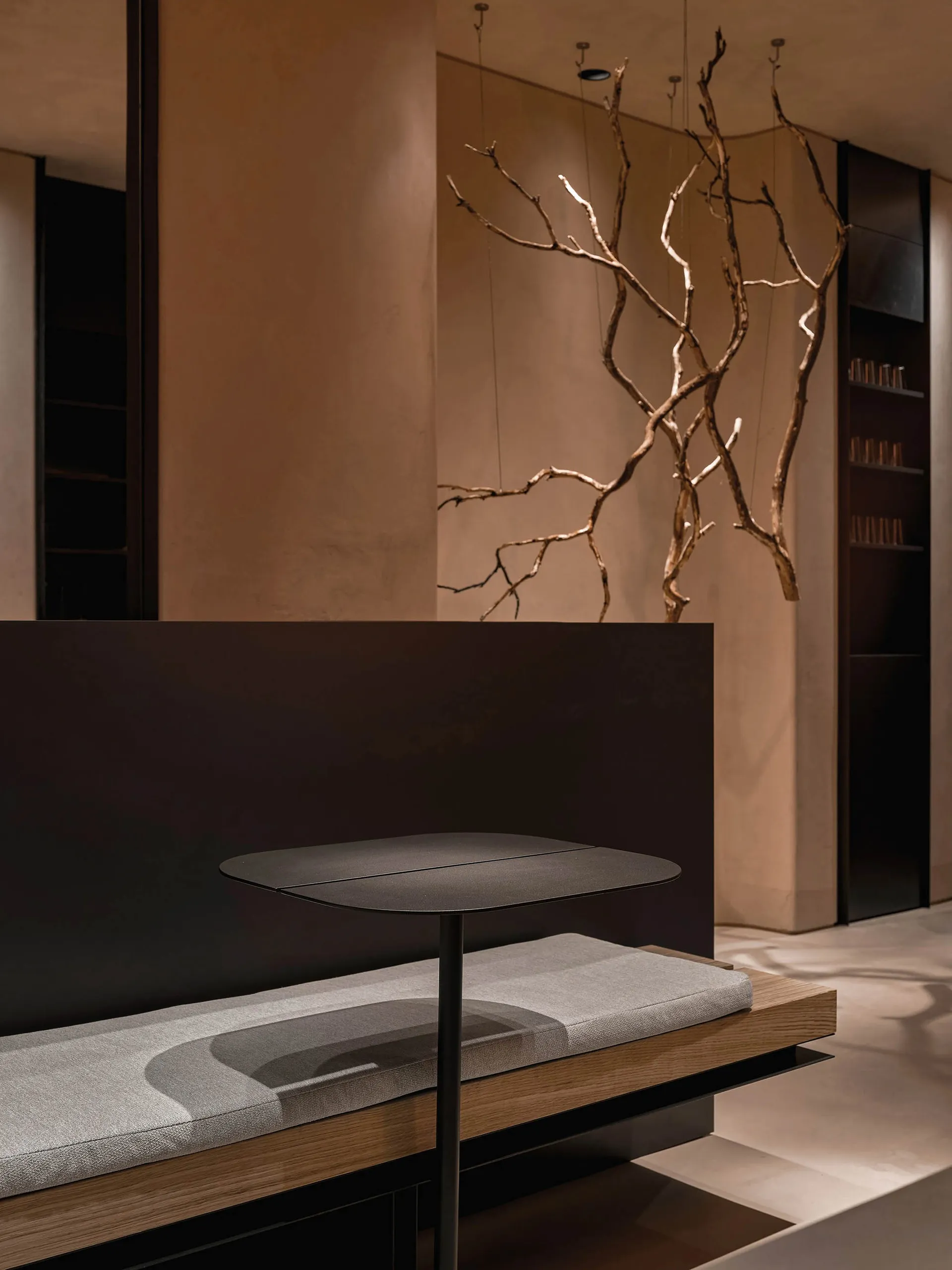 Modern minimalist floor lamp with a black metal base and wooden accents