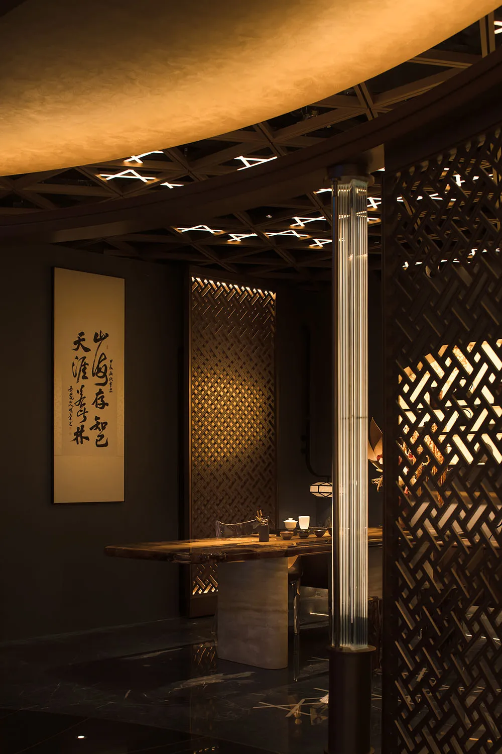 Modern restaurant interior featuring wooden panels, glass elements, and metal accents.
