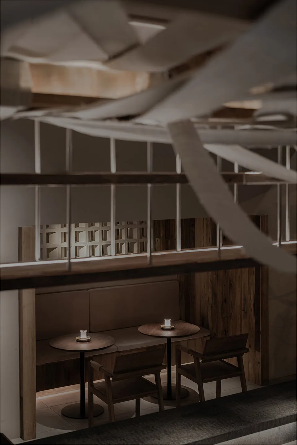 Modern cafe interior featuring wood and concrete elements