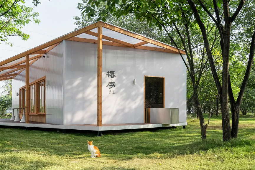 A minimalist residential building constructed with metal and glass materials.