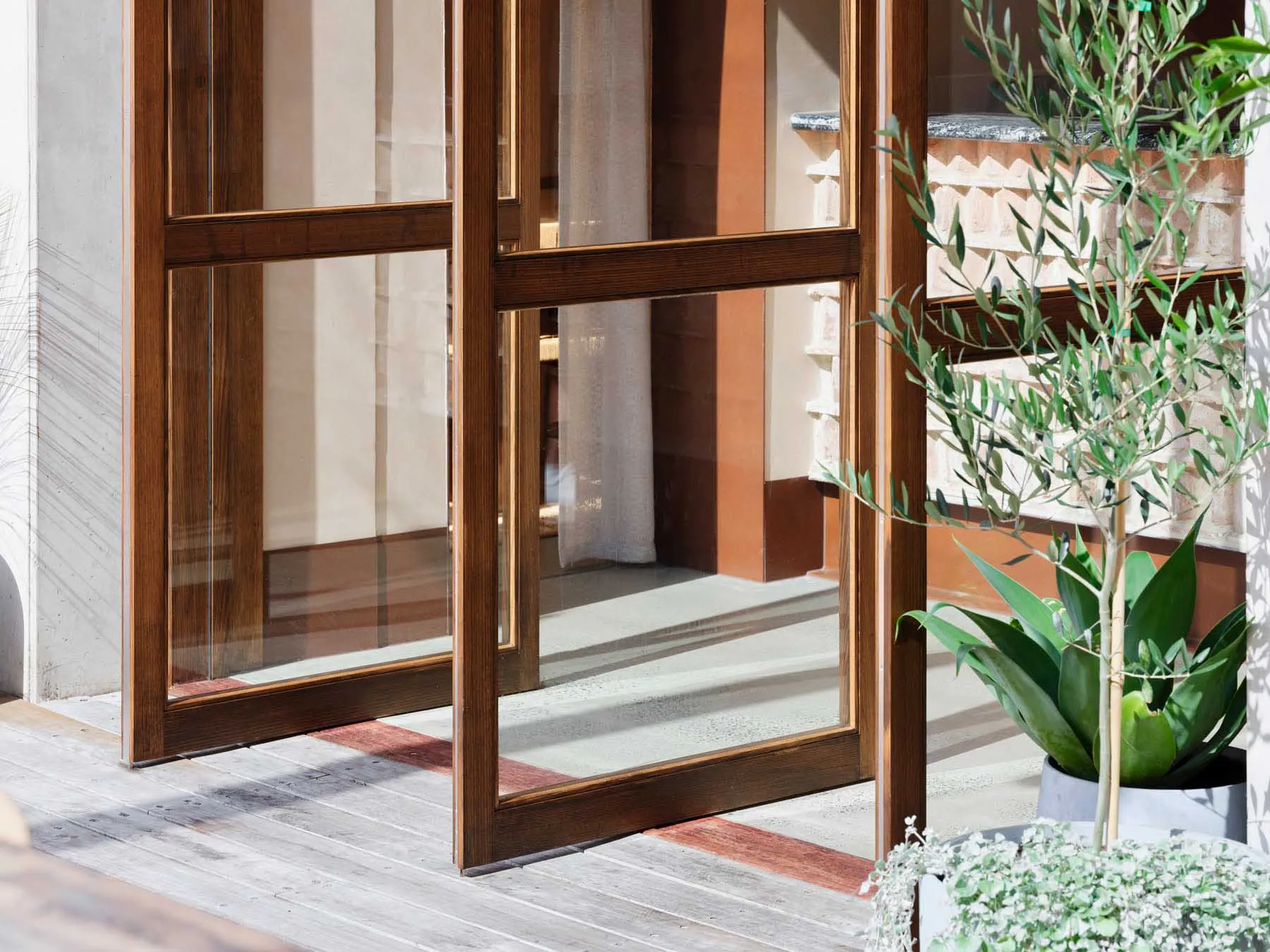 Modern front door with wooden frame and glass windows