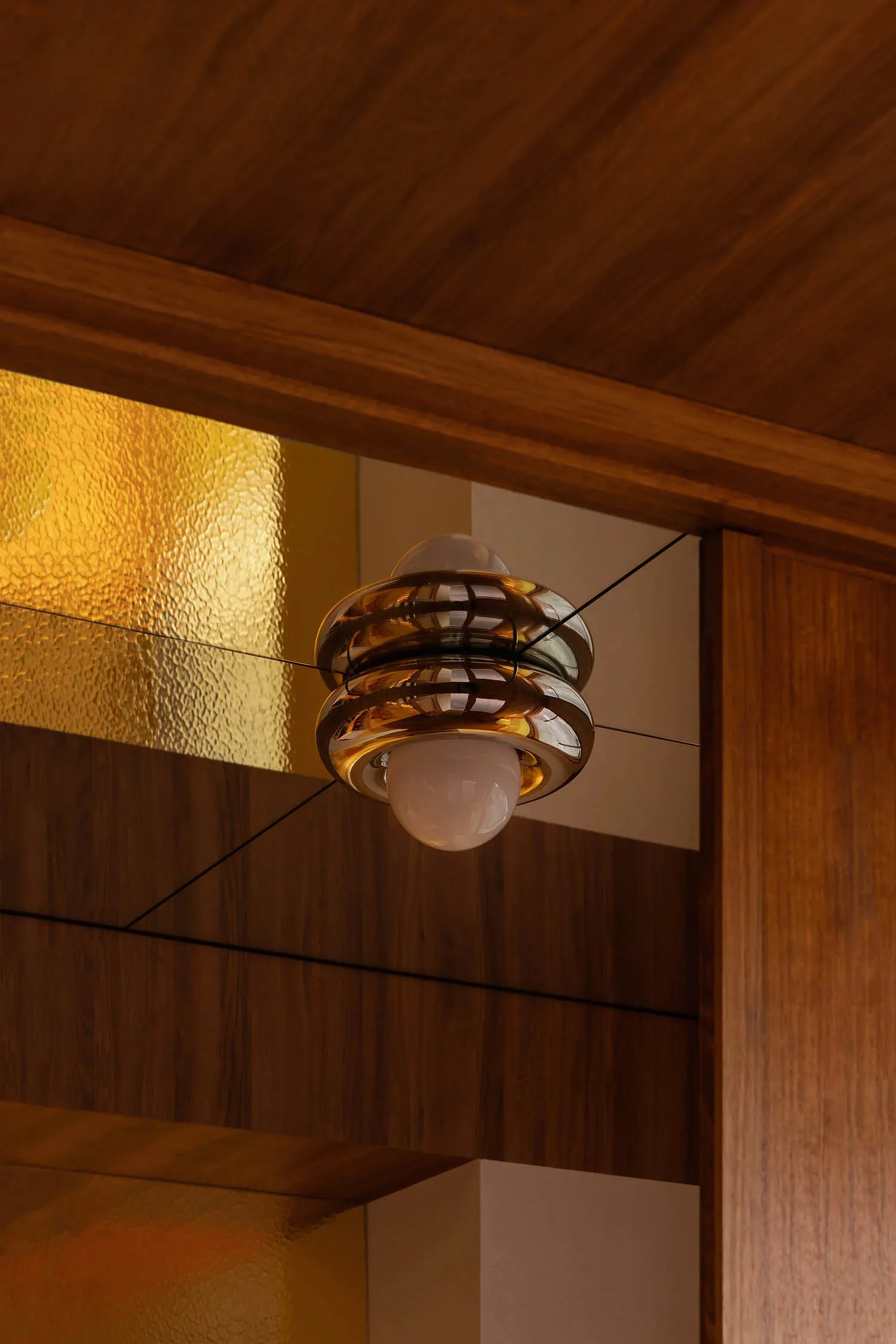 A modern lighting fixture with metallic rings