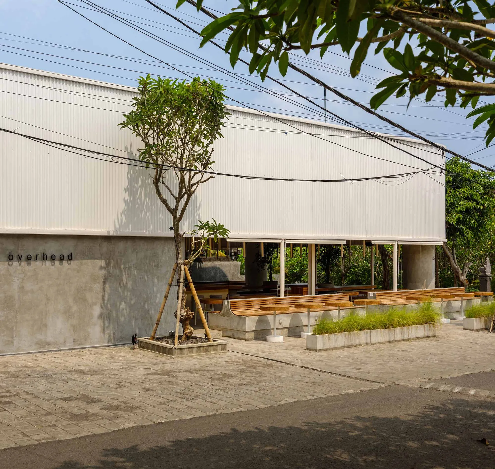 Modern industrial building exterior with concrete walls and minimalist design.