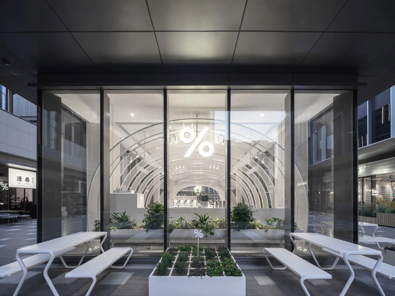 Modern cafe interior with glass walls and minimalist design