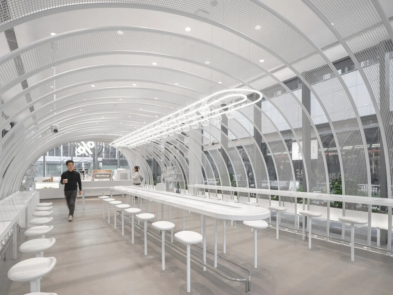 Modern coffee shop interior with white metallic frame.