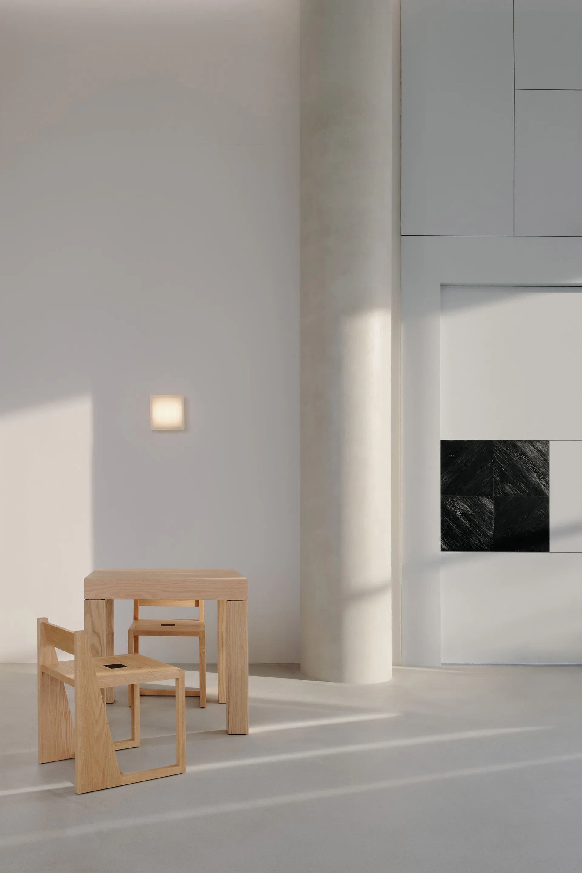 Modern minimalist living room featuring wood furniture and concrete elements.