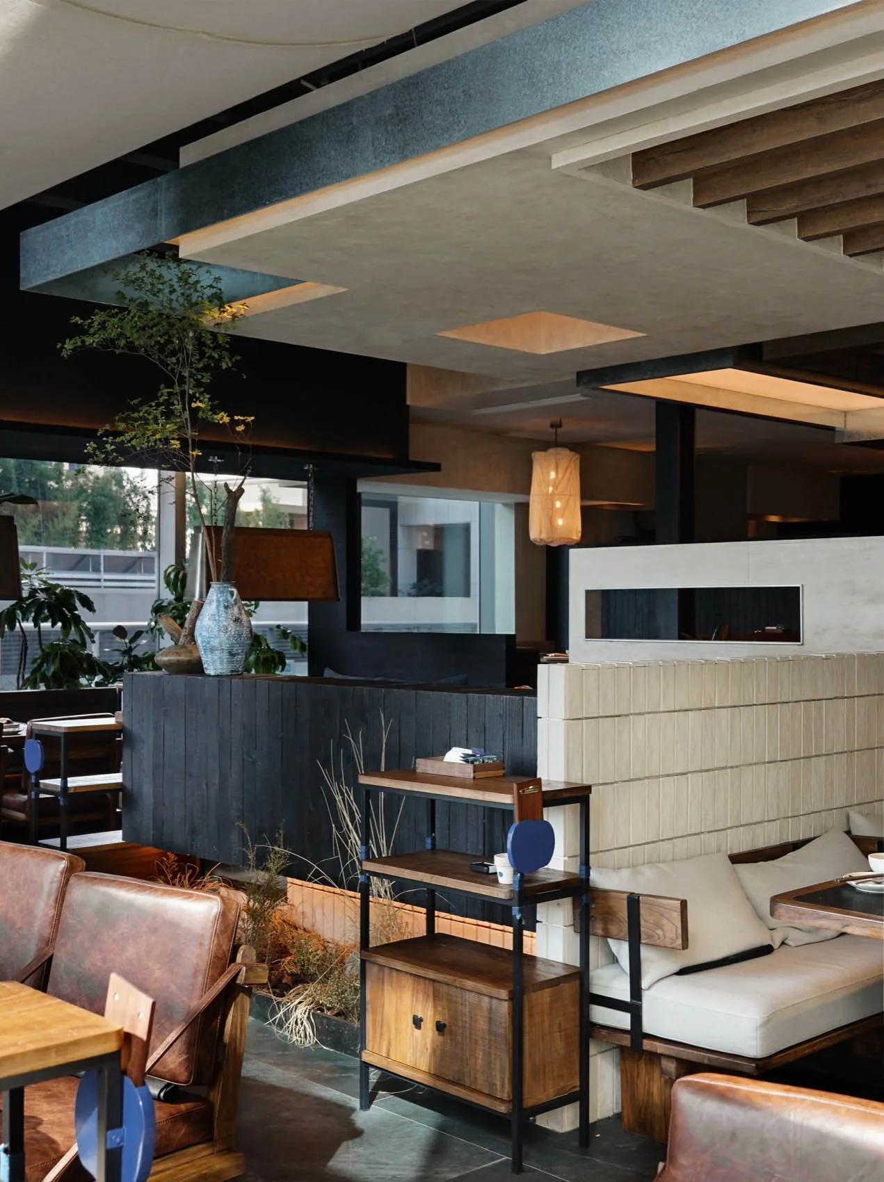 Modern cafe interior featuring wooden furniture and concrete walls