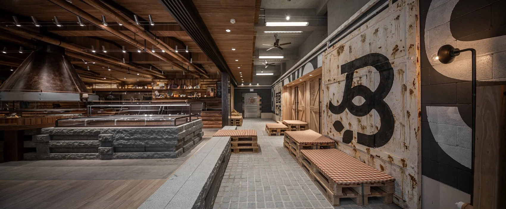 Industrial-style restaurant interior featuring timber materials and rustic decor.