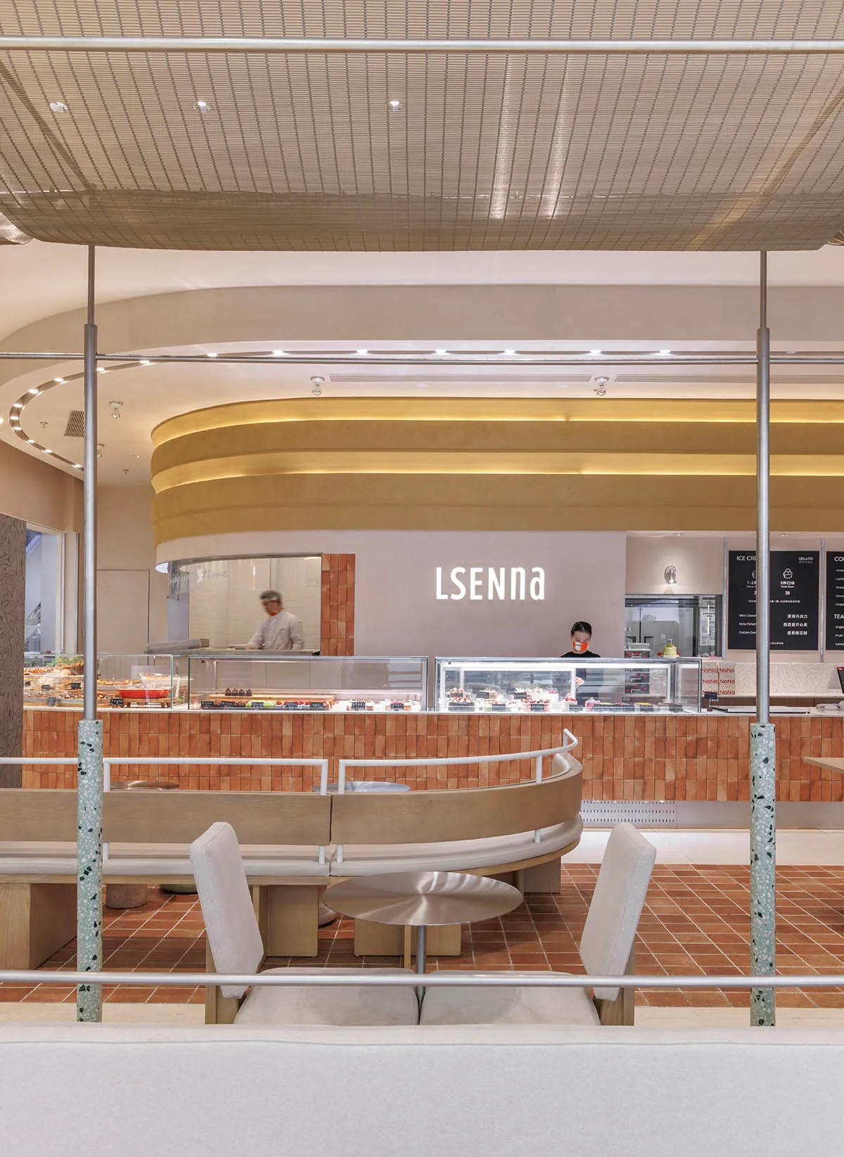Contemporary cafe interior featuring minimalist design and terrazzo tile flooring