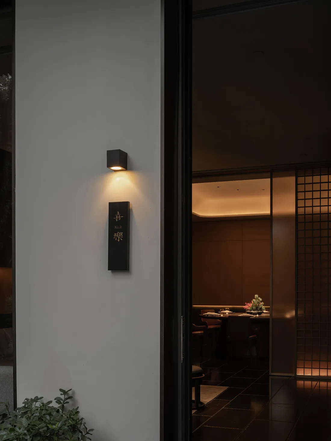 Modern restaurant interior featuring sleek, minimalist concrete design.