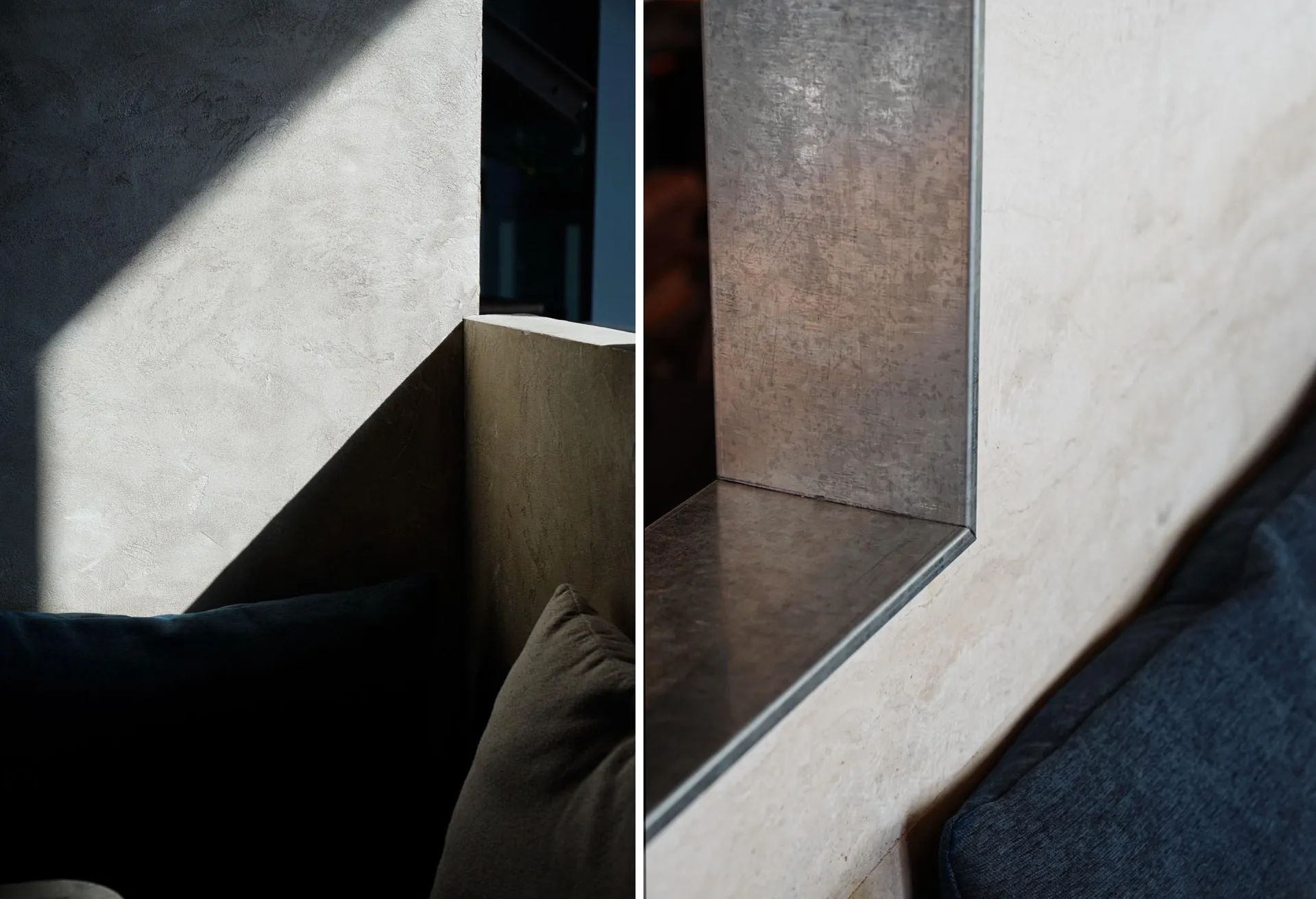 A modern industrial interior design featuring a concrete corner with a metal shelf.