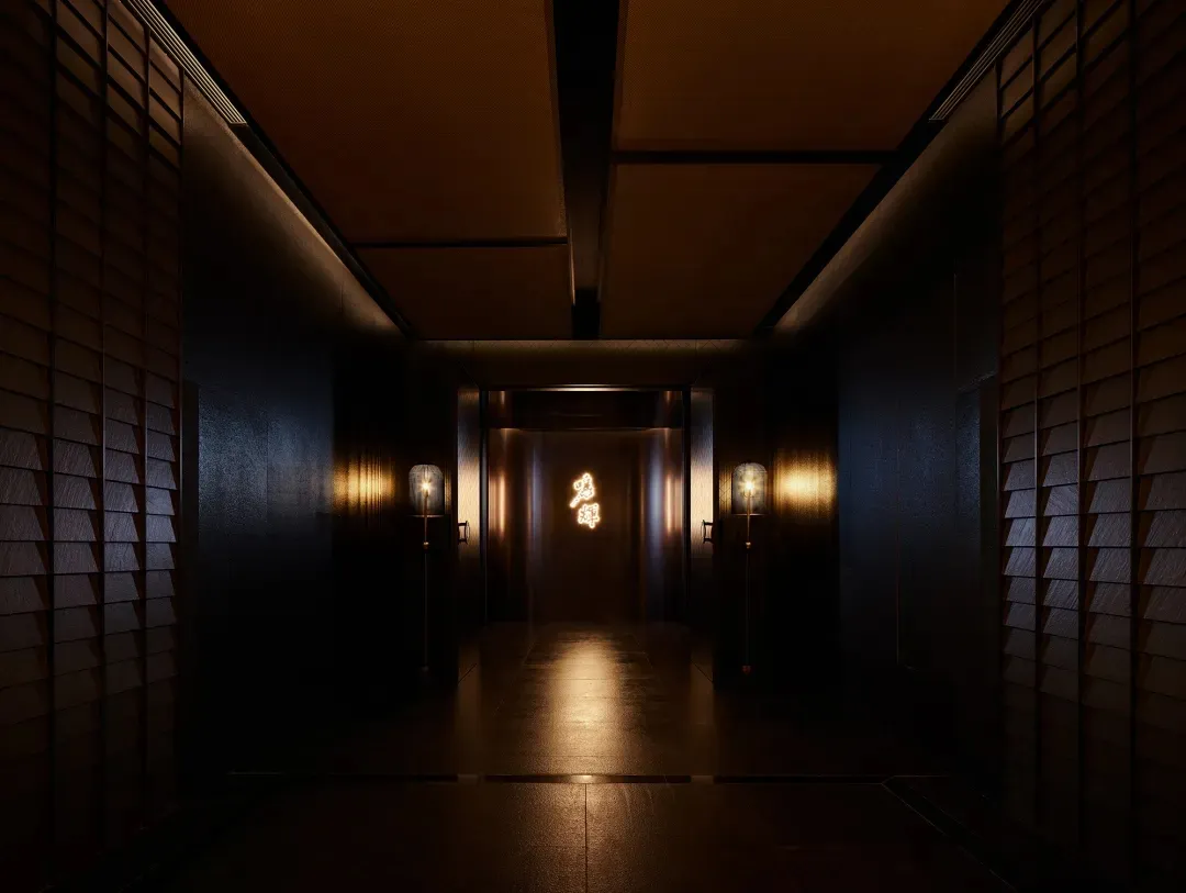 Modern, minimalist corridor with metallic tiles and warm lighting.