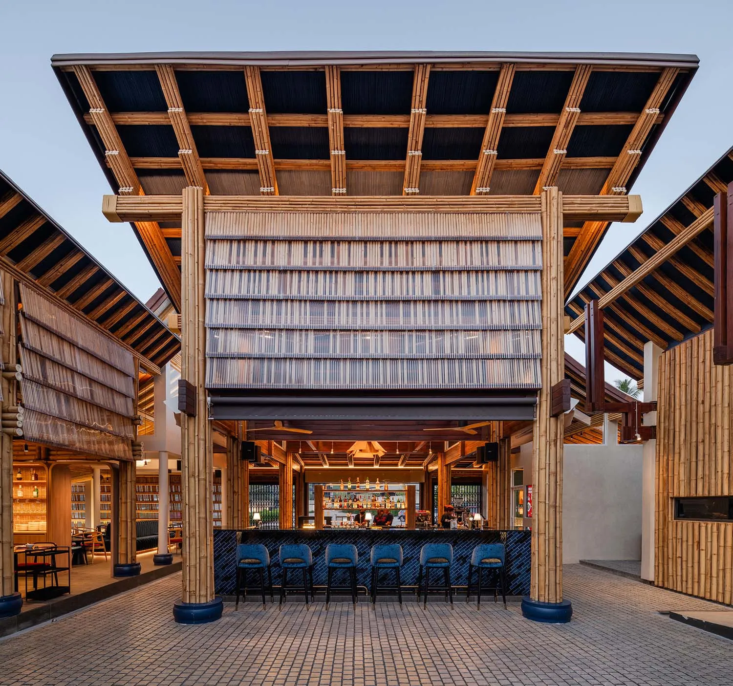 A minimalist restaurant bar with bamboo and glass features.