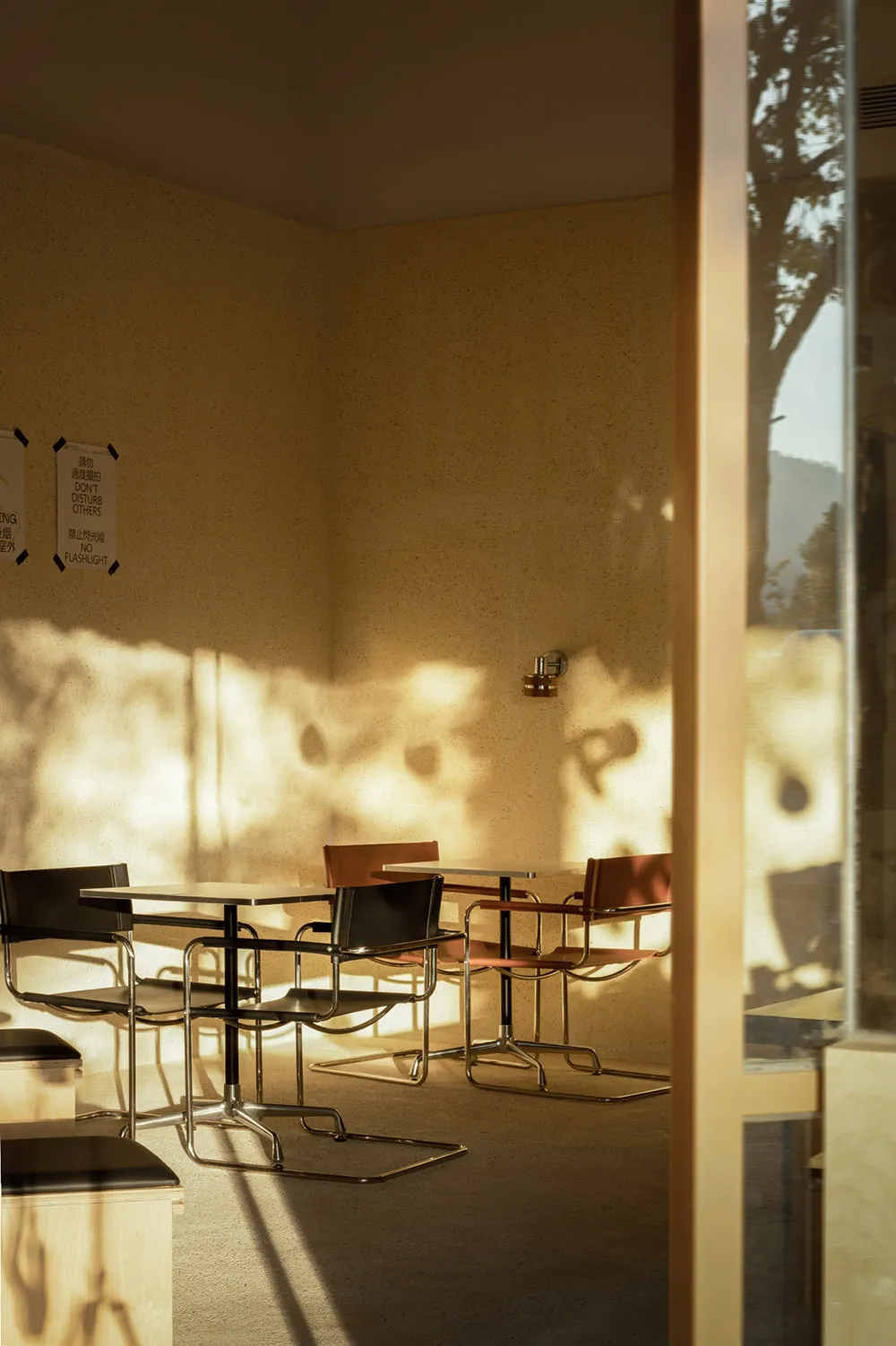 Modern cafe interior with metallic chairs and tables
