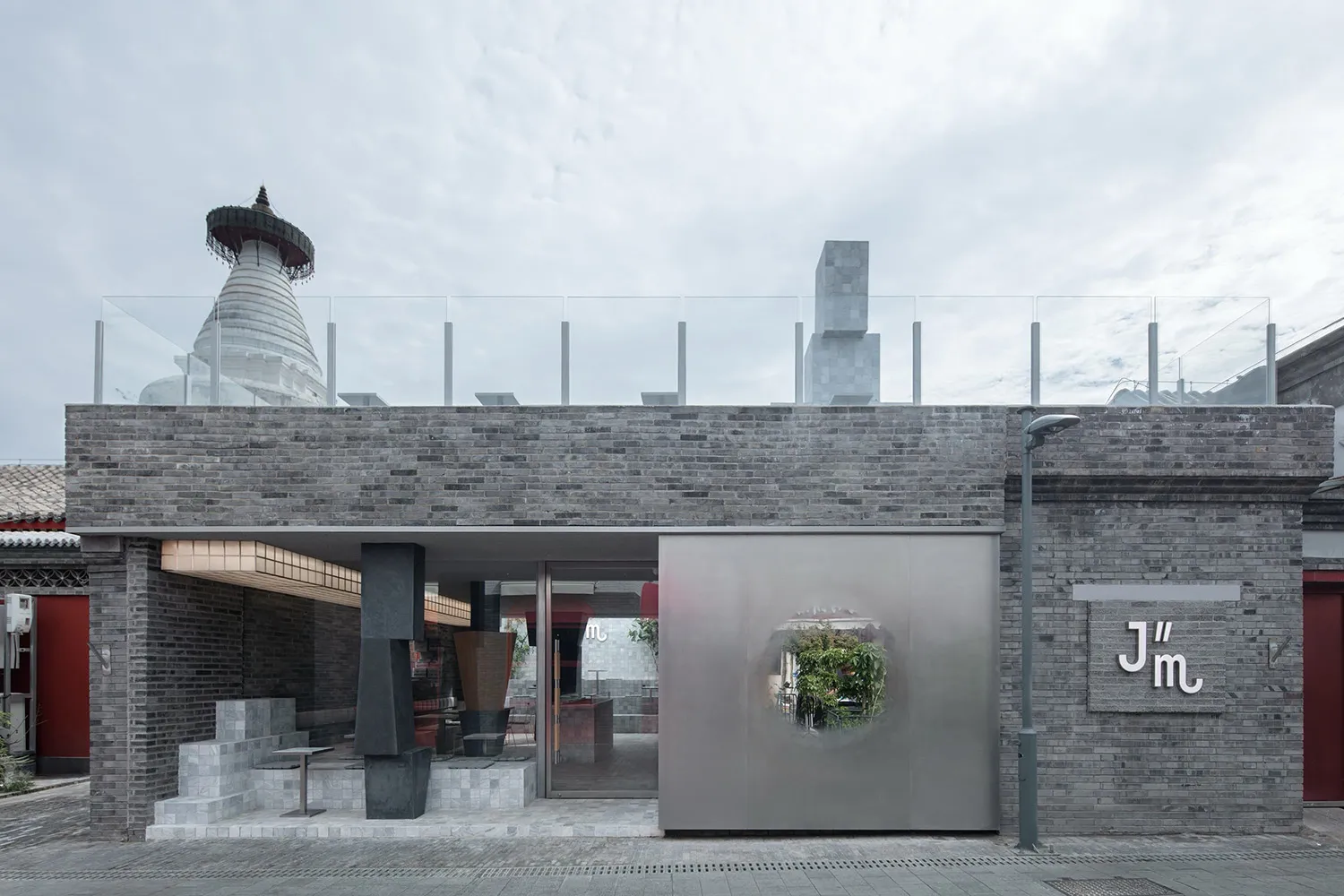 Commercial storefront with brick and metal exterior, featuring a modern design.