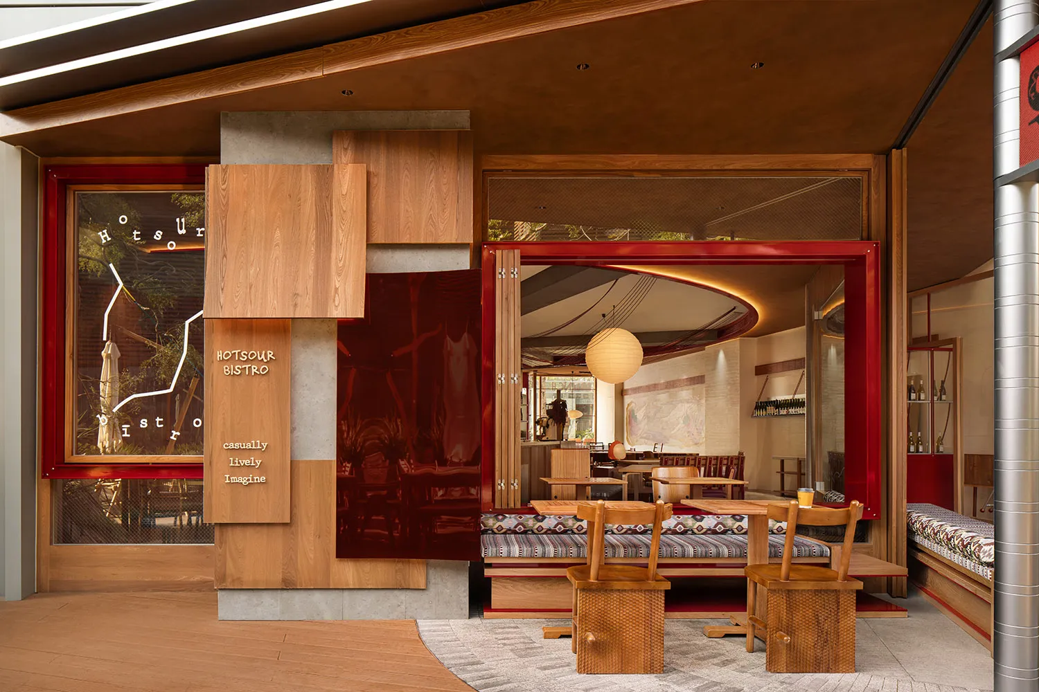 A modern restaurant interior featuring wooden elements and a cozy atmosphere.