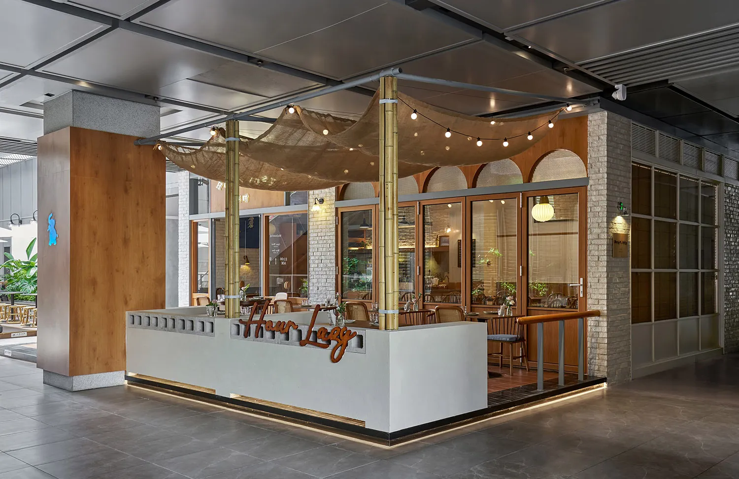 A modern industrial Scandinavian restaurant exterior featuring natural materials such as wood, concrete, and brick.