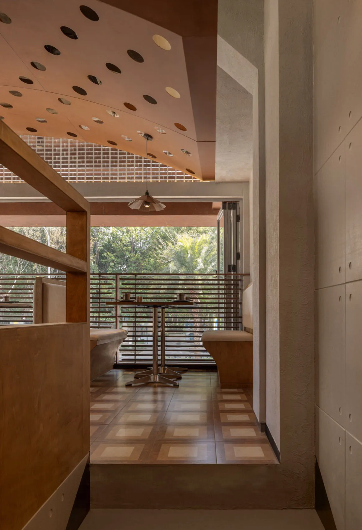 Modern restaurant interior with wood and concrete materials and brown floor tiles