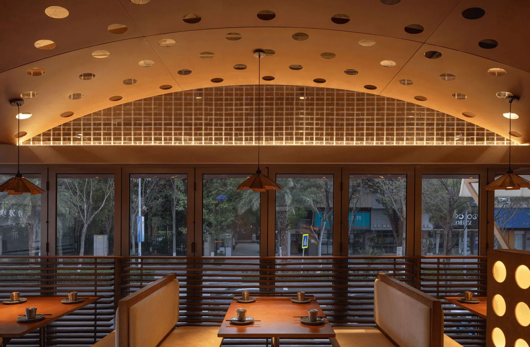 A modern restaurant interior featuring wooden materials.