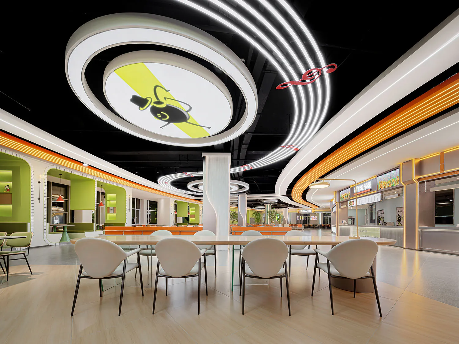 A spacious, modern eatery illuminated by neon lights.