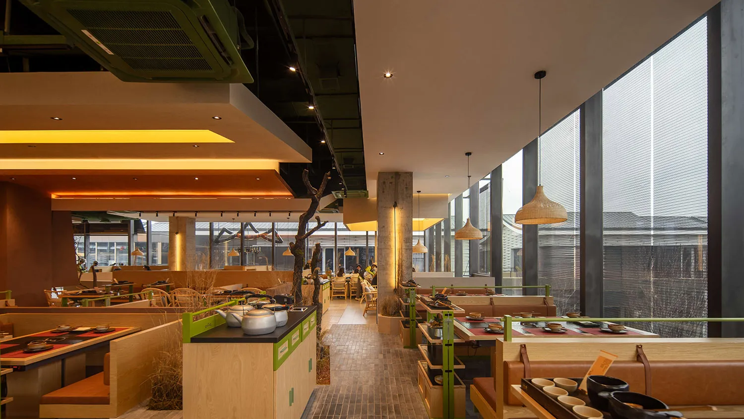 Restaurant interior with warm lighting and wooden elements