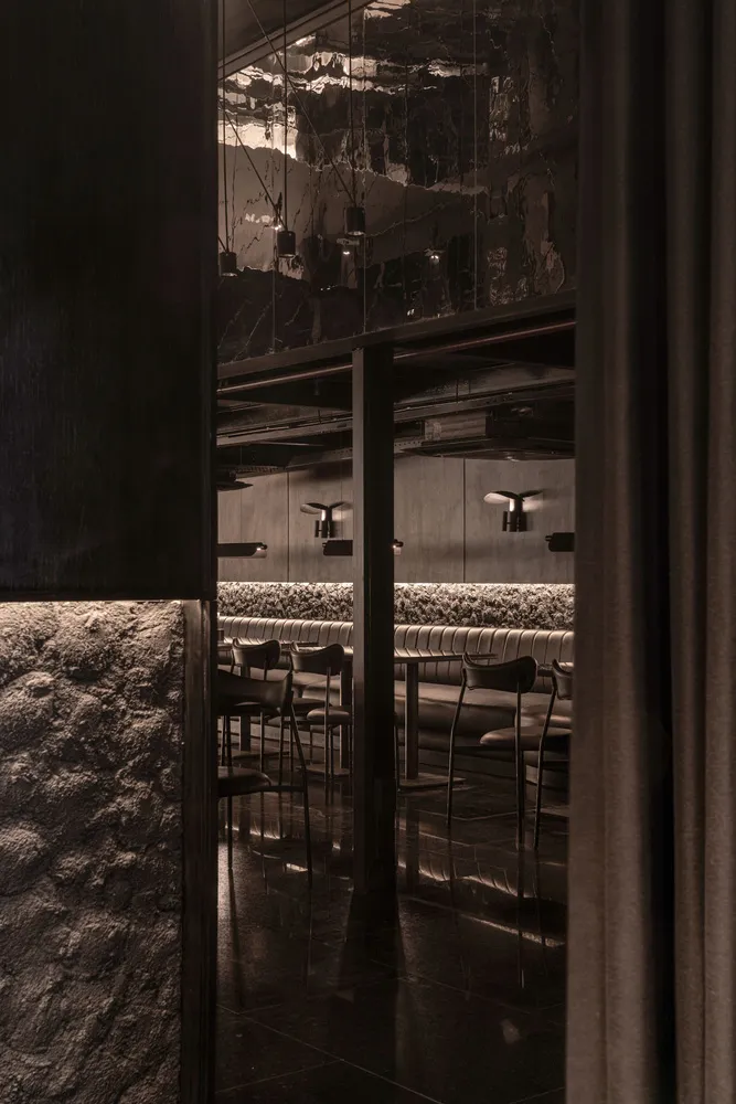 The lighting and seating arrangement in a modern restaurant interior.