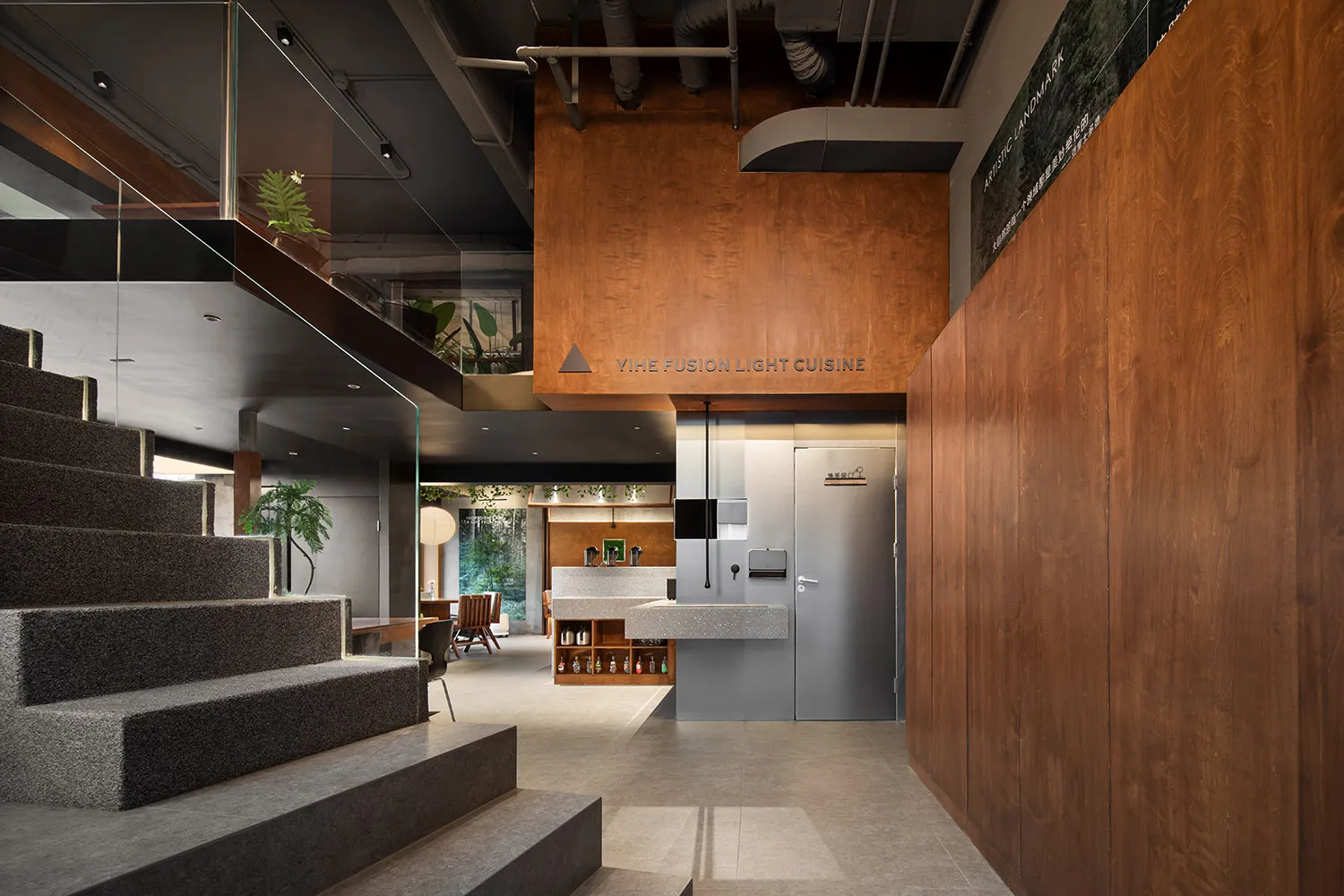 Industrial-style restaurant interior featuring concrete, wood, and metal materials