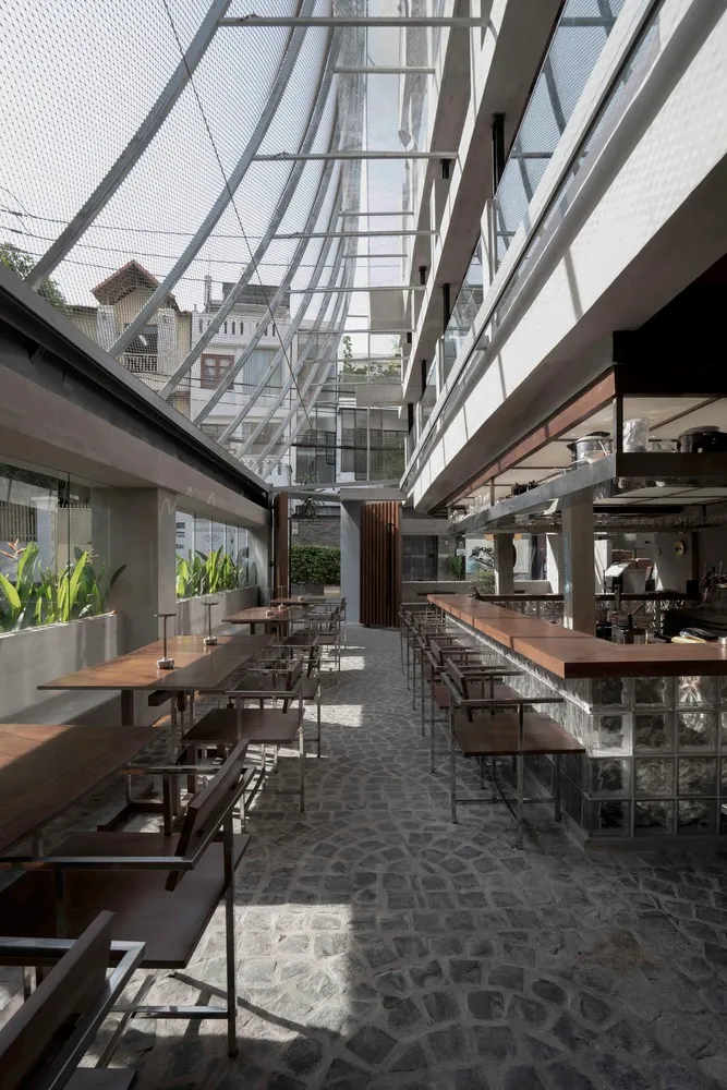 Industrial-style restaurant interior with concrete and glass materials