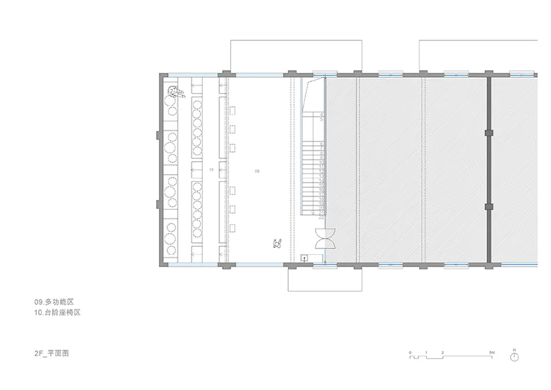 Floor plan of a multi-functional space with seating areas and a staircase.