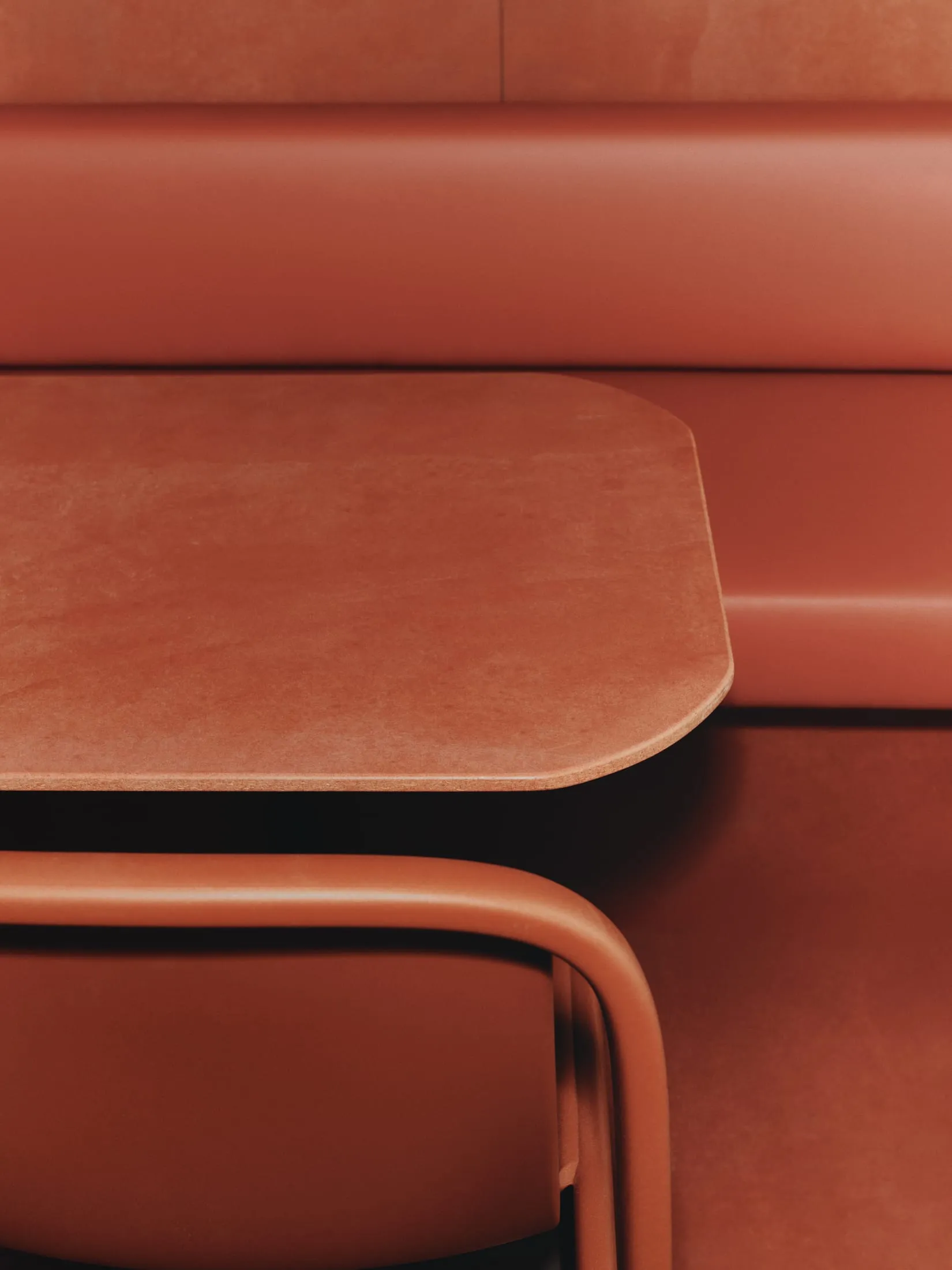 A close-up view of a modern restaurant booth upholstered in leather and cork material, featuring an integrated tabletop surfa