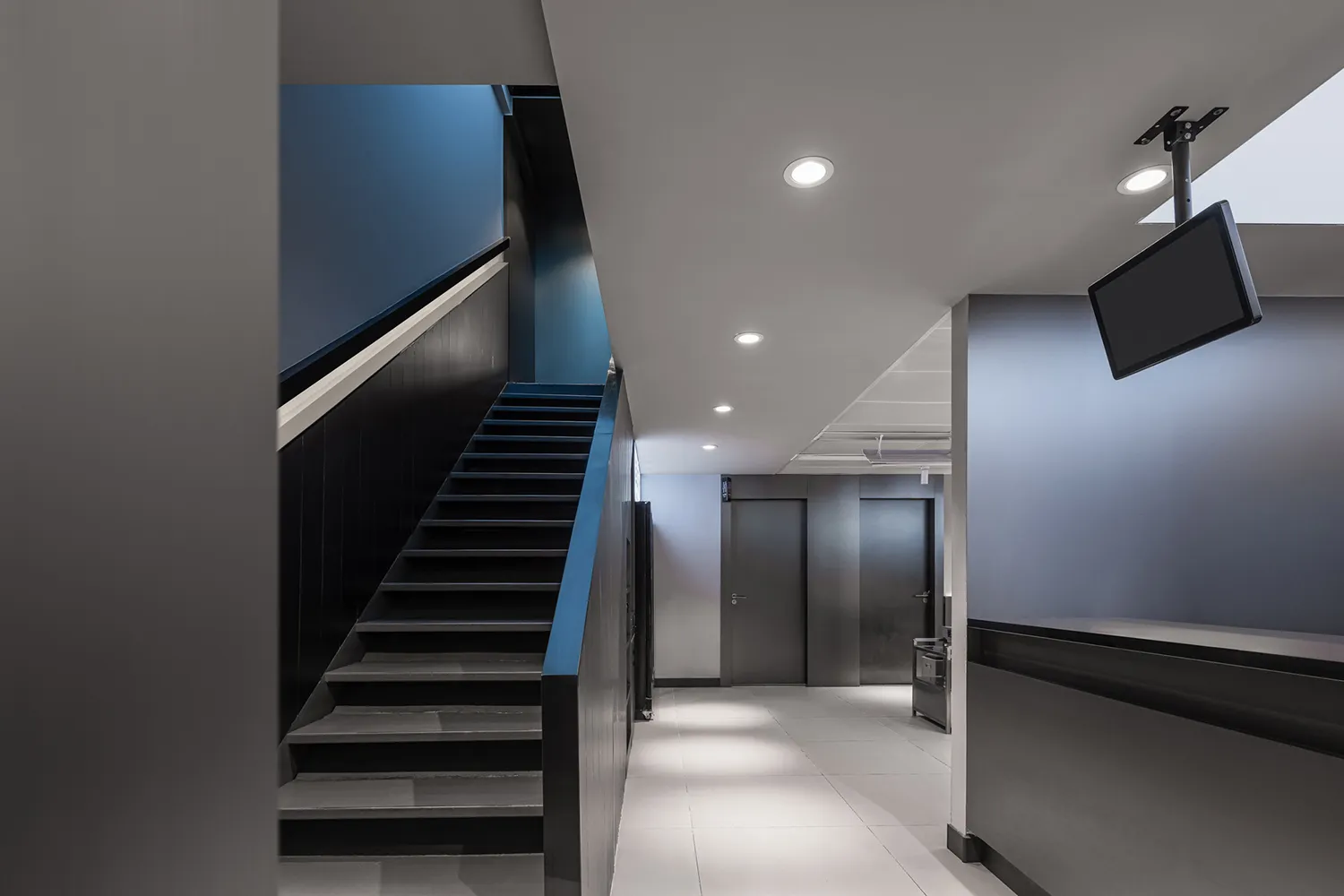A minimalist office space with modern metal accents and clean lines.