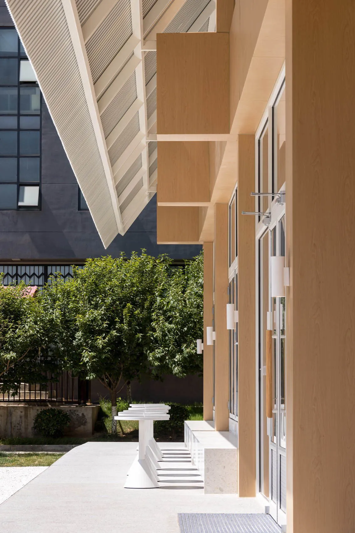 Modern architectural design featuring glass and wood materials.