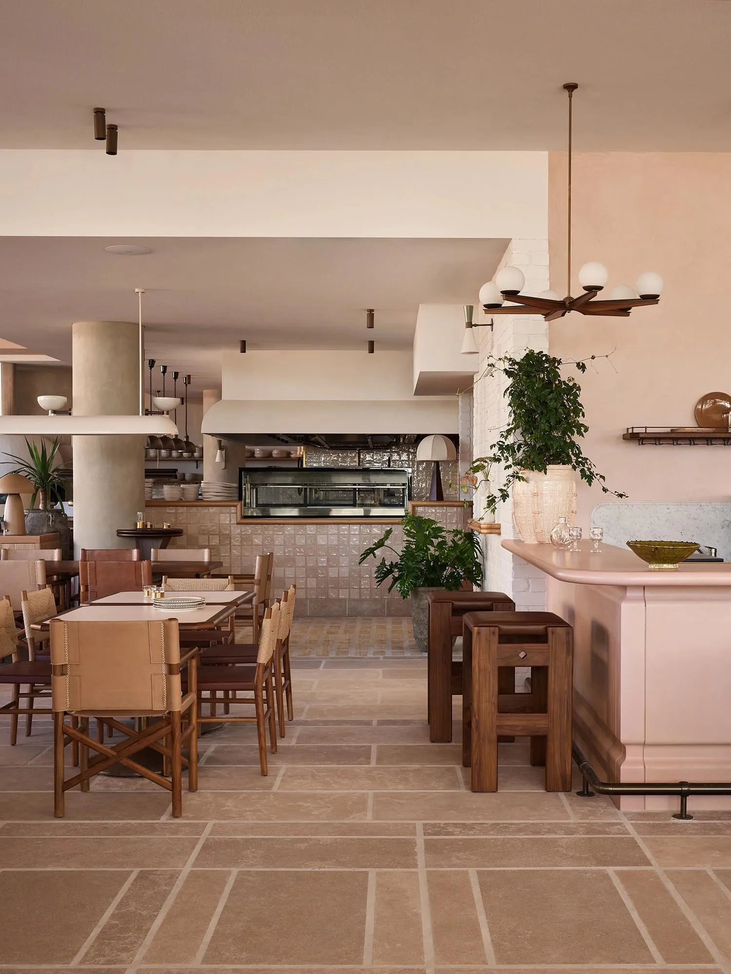 A modern cafe interior featuring a terrazzo floor and minimalist design elements.