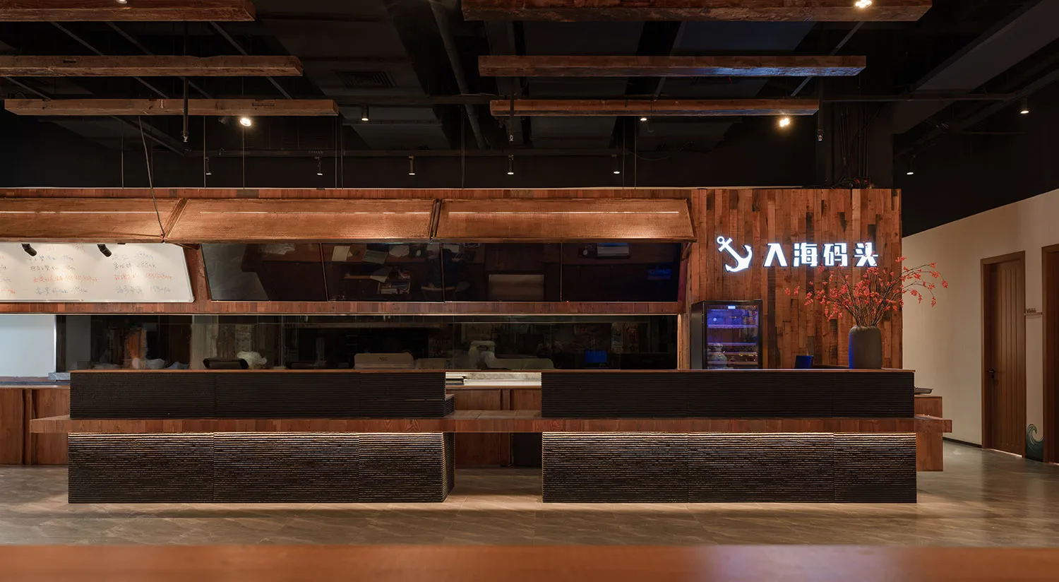 An industrial-style retail store interior featuring wooden accents, glass countertops, and metallic fixtures.