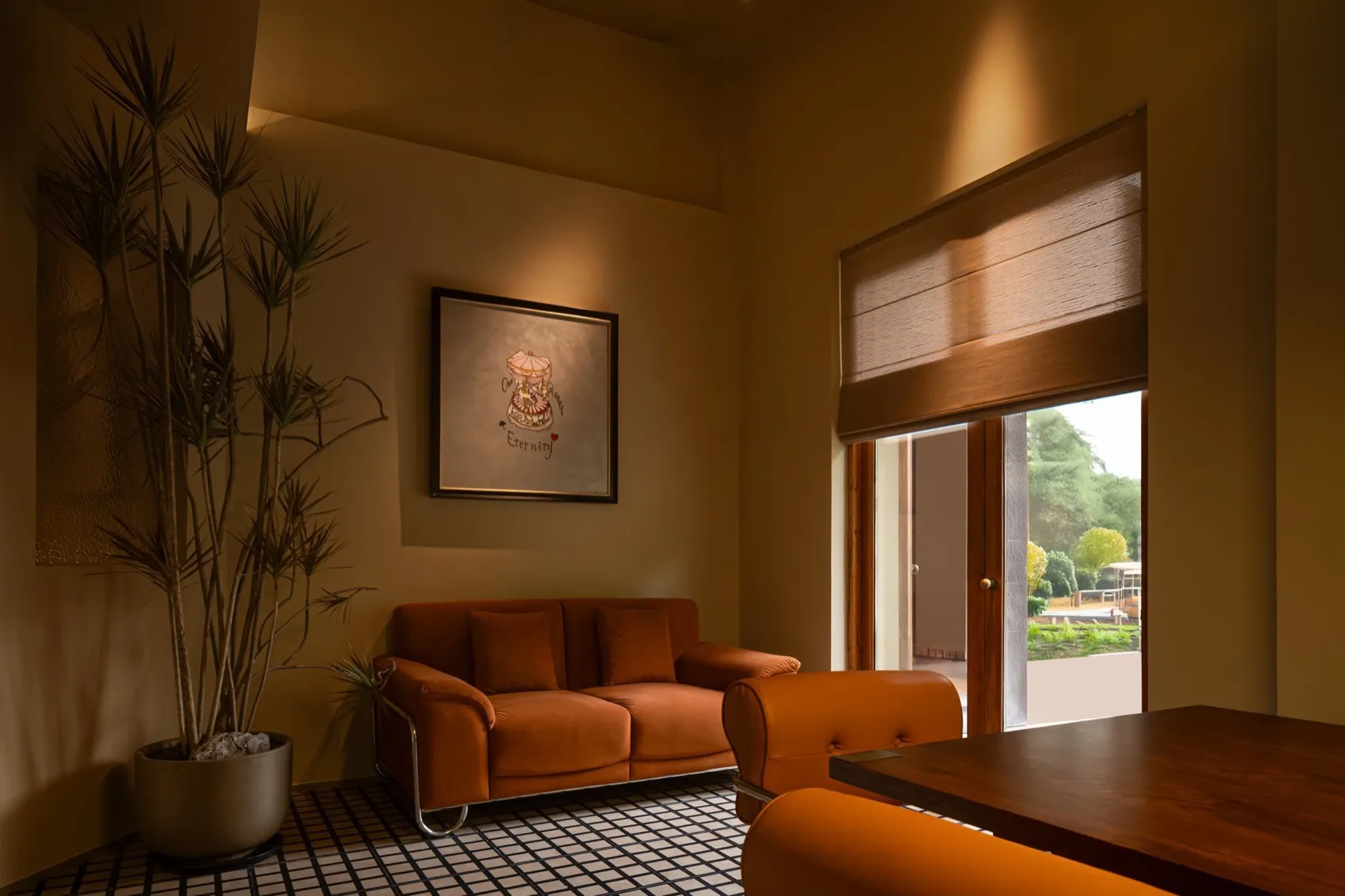 A modern living room featuring a bright orange leather couch with matching orange cushions.