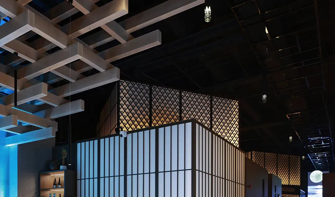 Modern restaurant interior featuring metallic grid walls